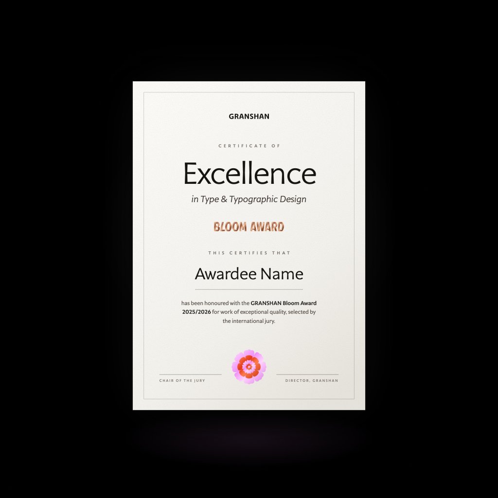 Mock-up of a GRANSHAN Bloom Award certificate of excellence on smooth ivory stock against black, with a copper foil BLOOM AWARD wordmark and the BLOOM flower seal.